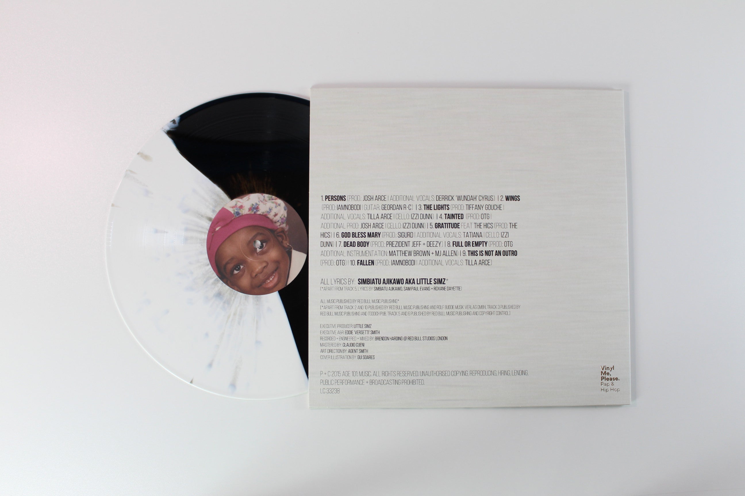 Little Simz - A Curious Tale Of Trials + Persons on Age 101 Vinyl Me Please Black/White Split + Gold Spatter Vinyl Reissue