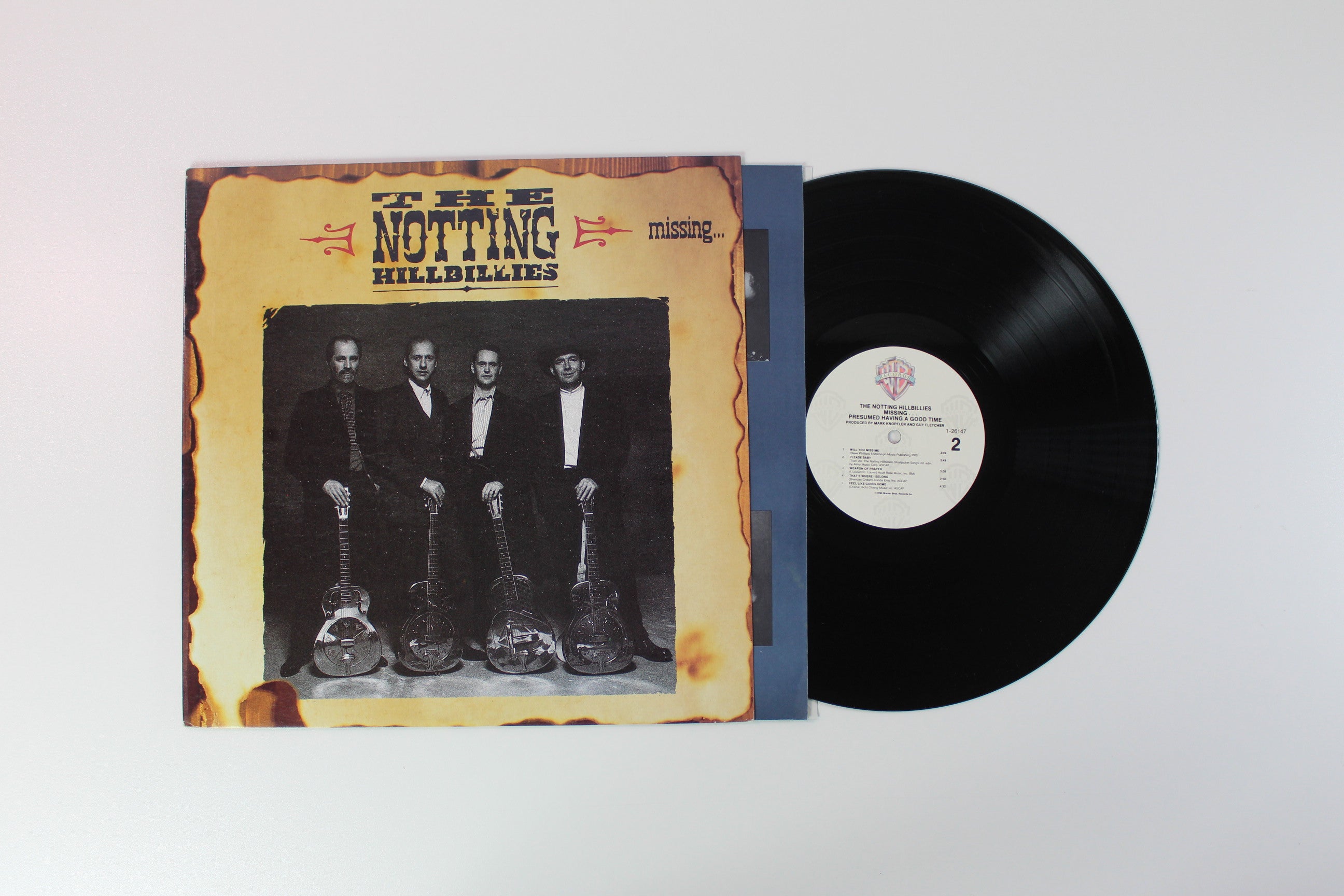 The Notting Hillbillies - Missing... Presumed Having A Good Time on Warner Bros. Records