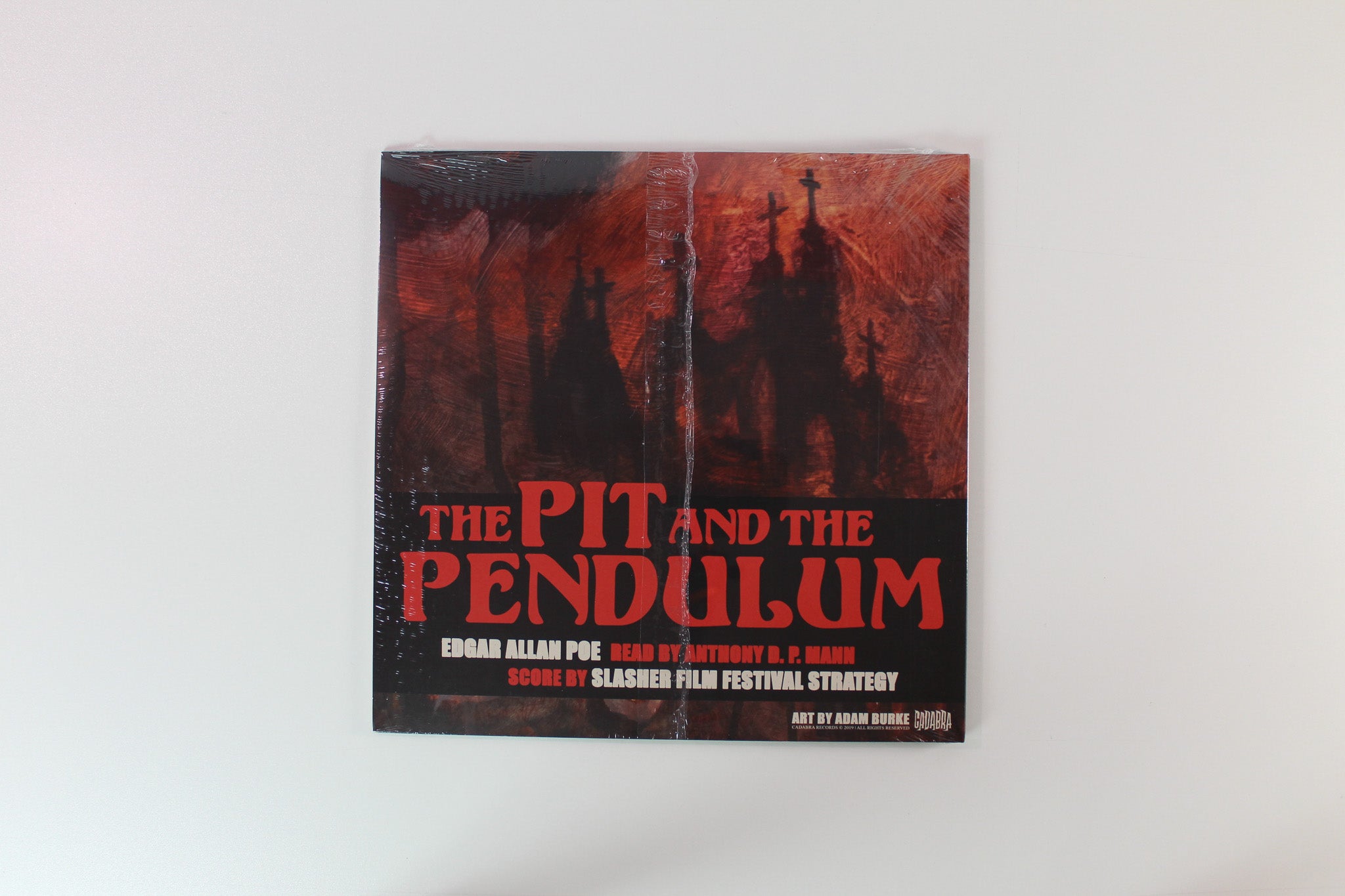 Edgar Allan Poe - The Pit And The Pendulum on Cadabra Records Ltd. Subscriber Variant Dark Yellow w/ Black Swirl