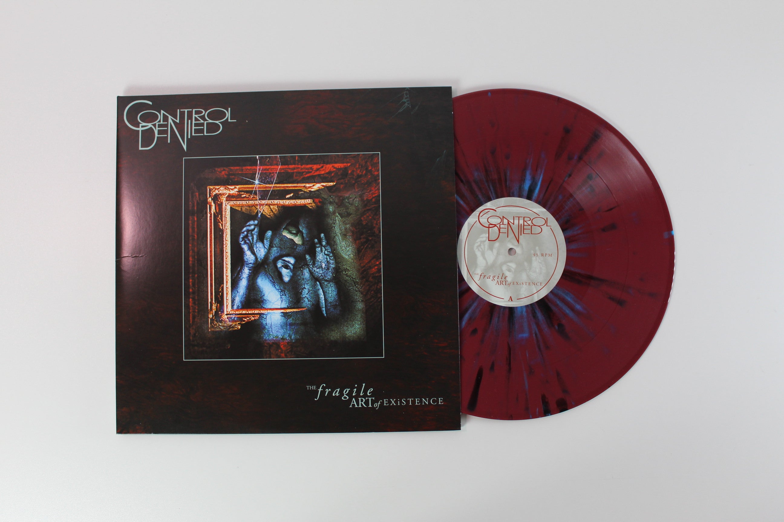 Control Denied - The Fragile Art Of Existence on Relapse Ltd Oxblood with Black and Cyan Blue Splatter Reissue