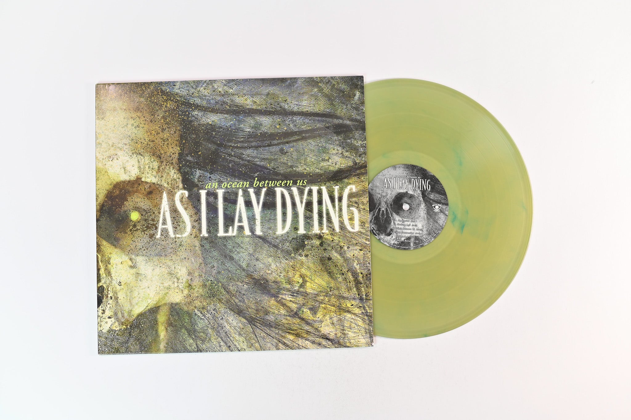As I Lay Dying - An Ocean Between Us on Metal Blade Amber with Aqua Smoke Reissue