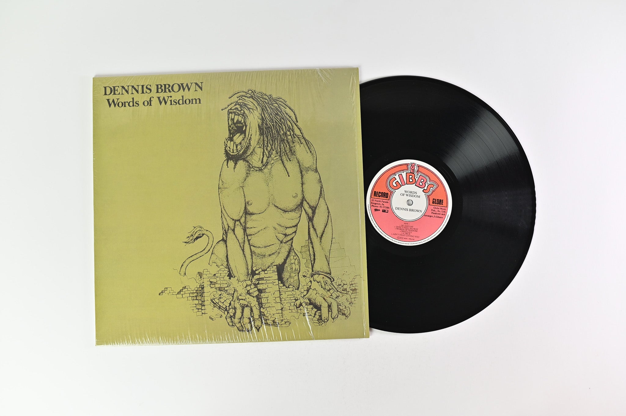 Dennis Brown performing on stage, his posture radiating passion and intensity, capturing the raw emotion of his live performances.