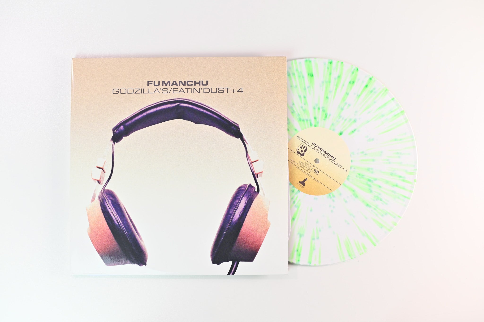 Fu Manchu - Godzilla's / Eatin' Dust +4 on At The Dojo Ltd 45 RPM Neon Green / White Splatter Reissue