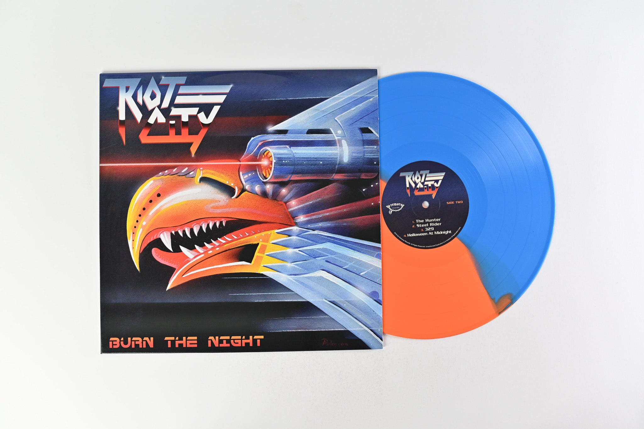 Riot City - Burn The Night on No Remorse Records Half Orange/Half Blue Vinyl