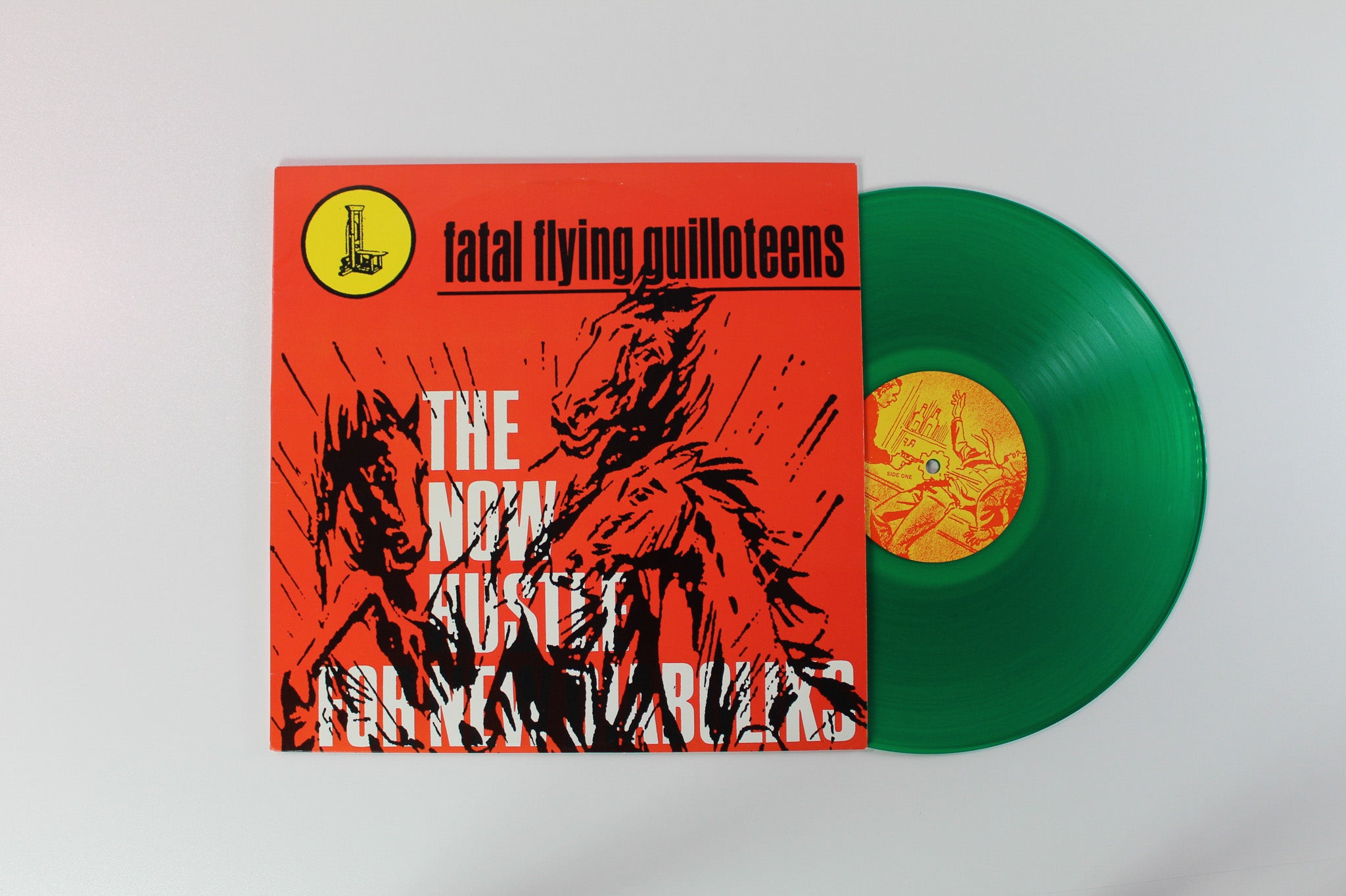 The Fatal Flyin' Guilloteens - The Now Hustle For New Diaboliks on Estrus Records - Green Vinyl