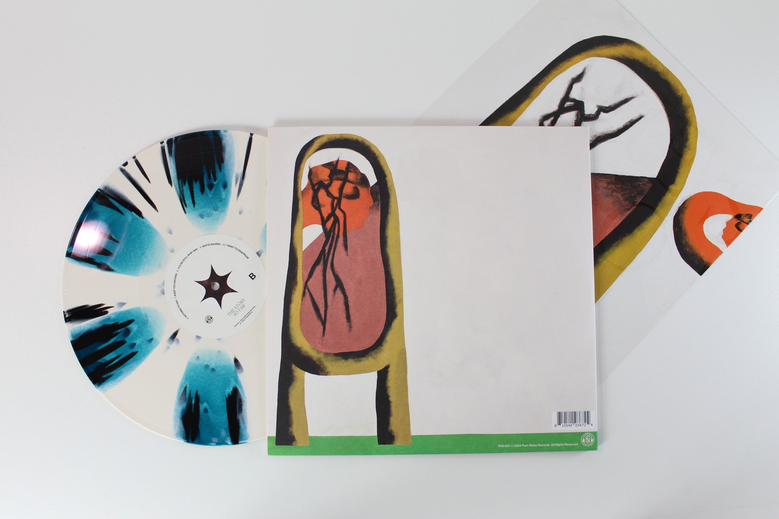 The Story So Far - I Want To Disappear on Pure Noise Records – Bone & Seablue Pinwheel With Black Splatter Colored Vinyl