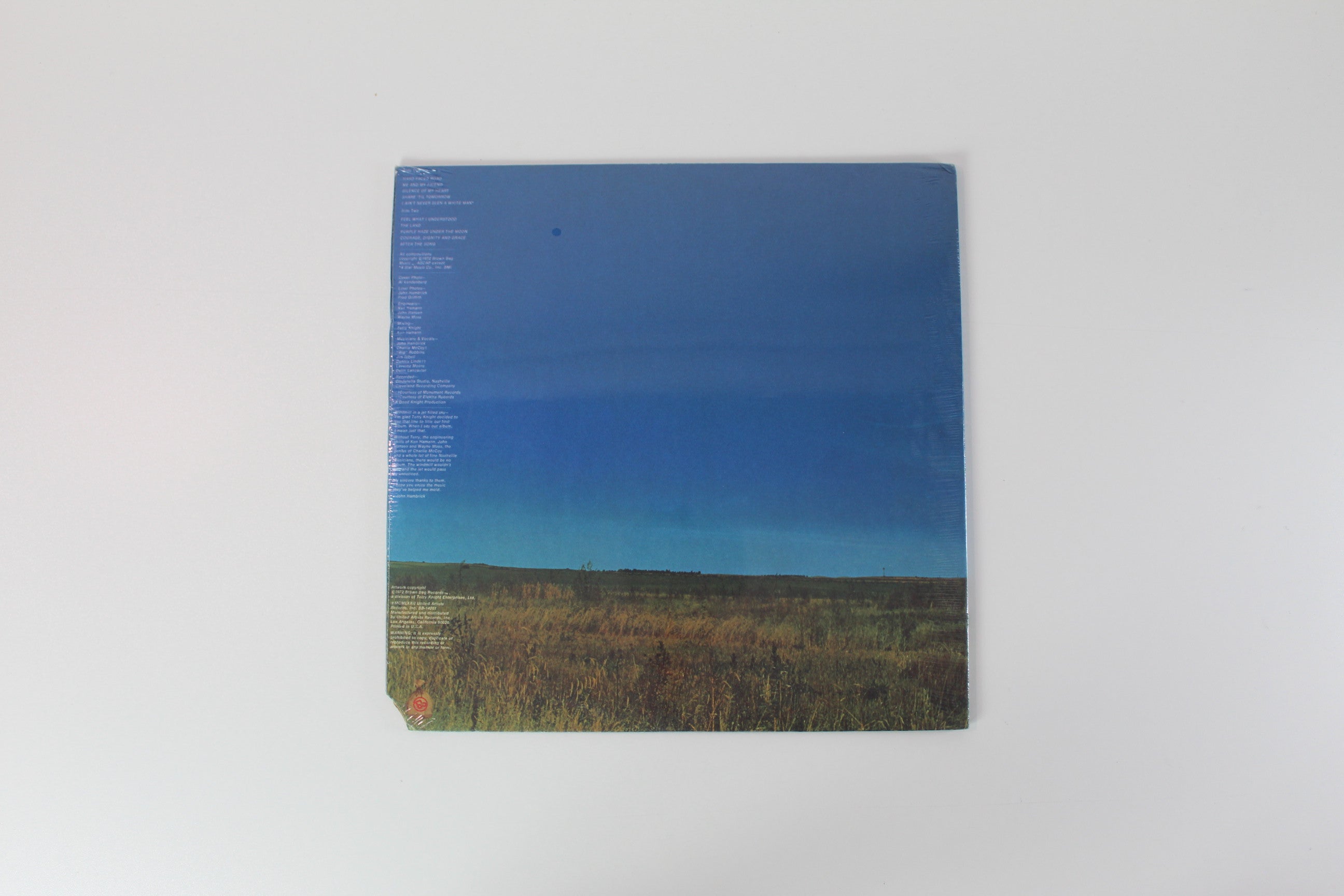 John Hambrick - Windmill In A Jet Filled Sky on Brown Bag Breaks Samples Sealed