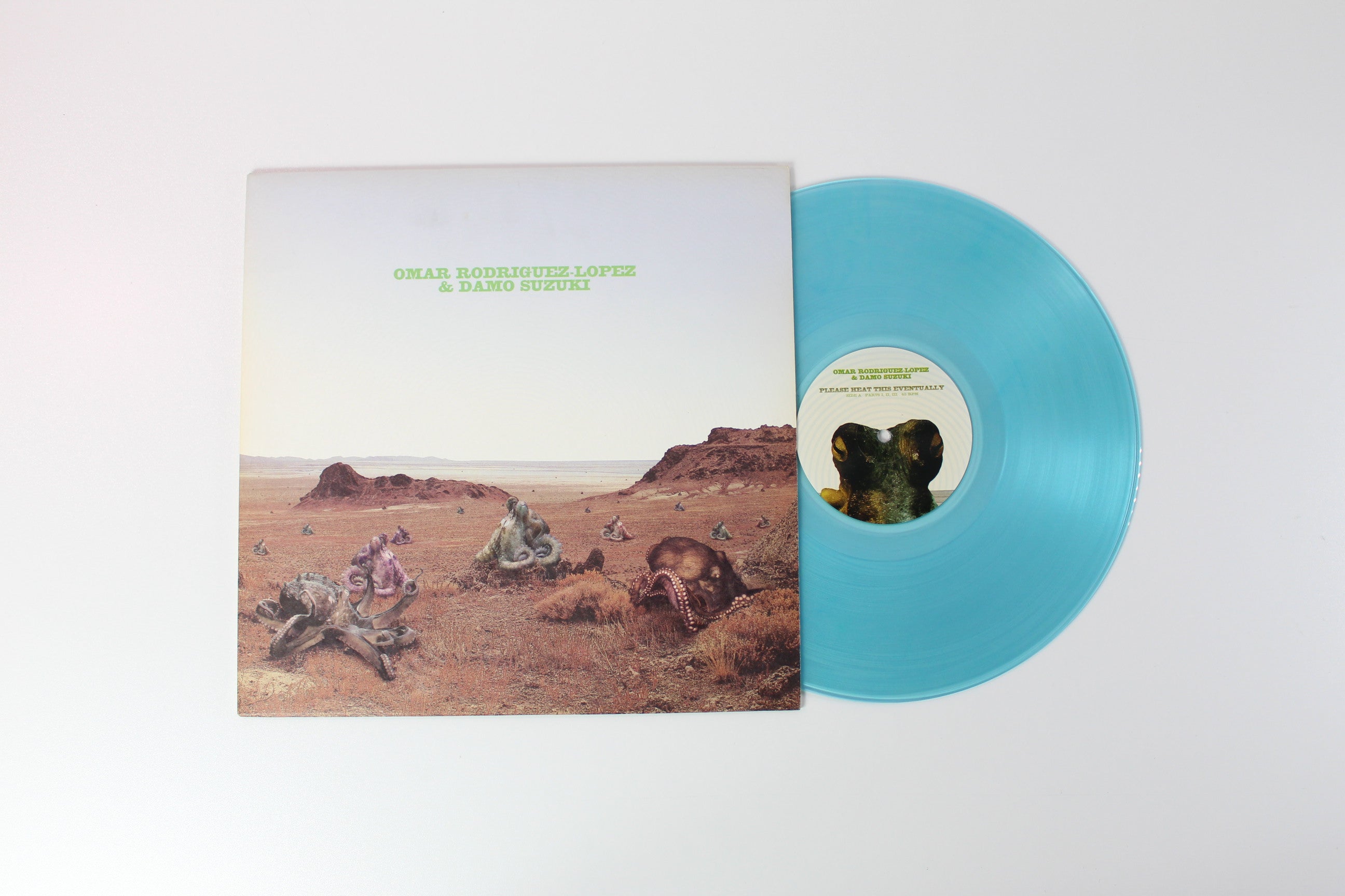 Omar Rodriguez-Lopez - Please Heat This Eventually on Gold Standard Laboratories Clear Light Blue 12" 45 RPM EP