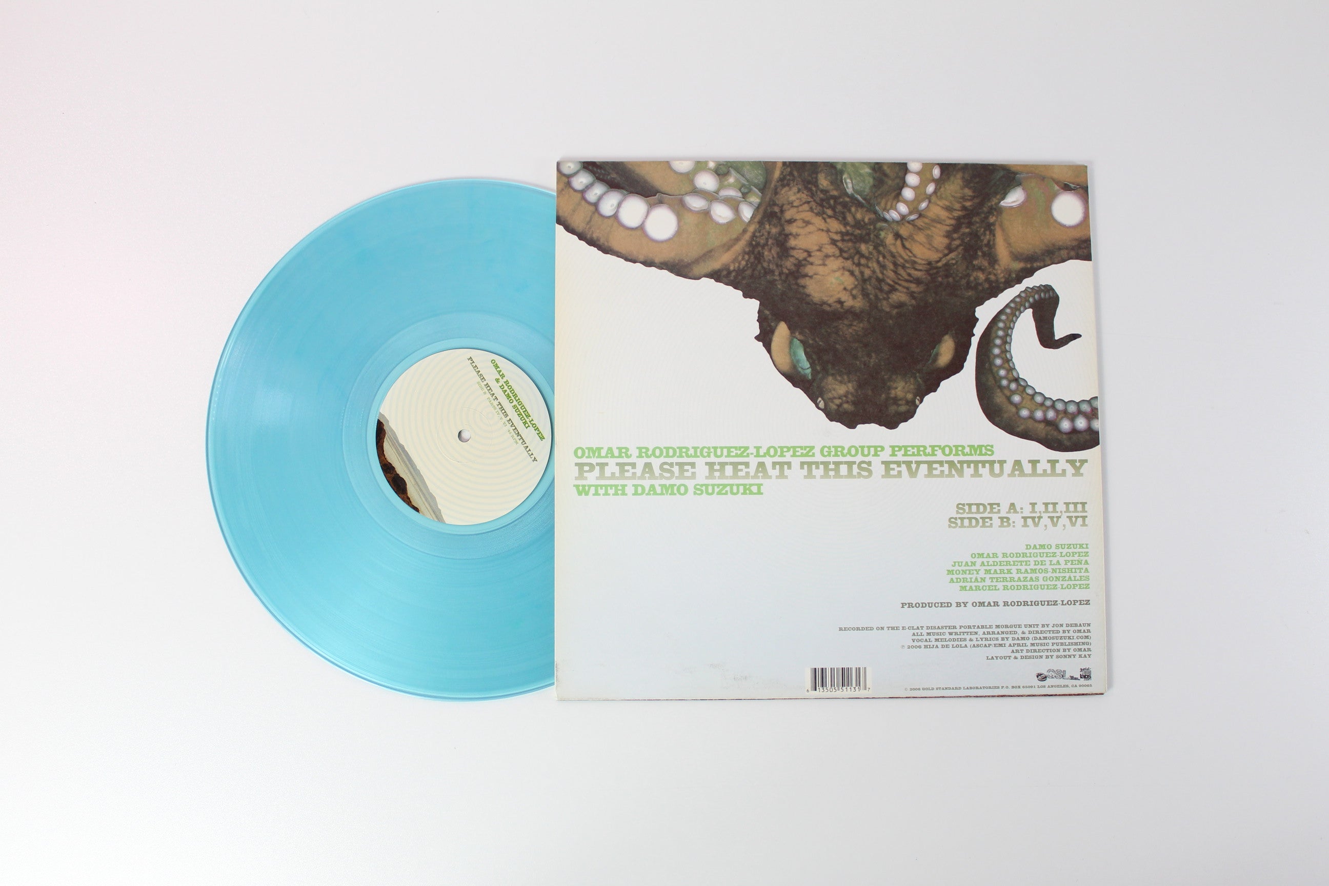 Omar Rodriguez-Lopez - Please Heat This Eventually on Gold Standard Laboratories Clear Light Blue 12" 45 RPM EP