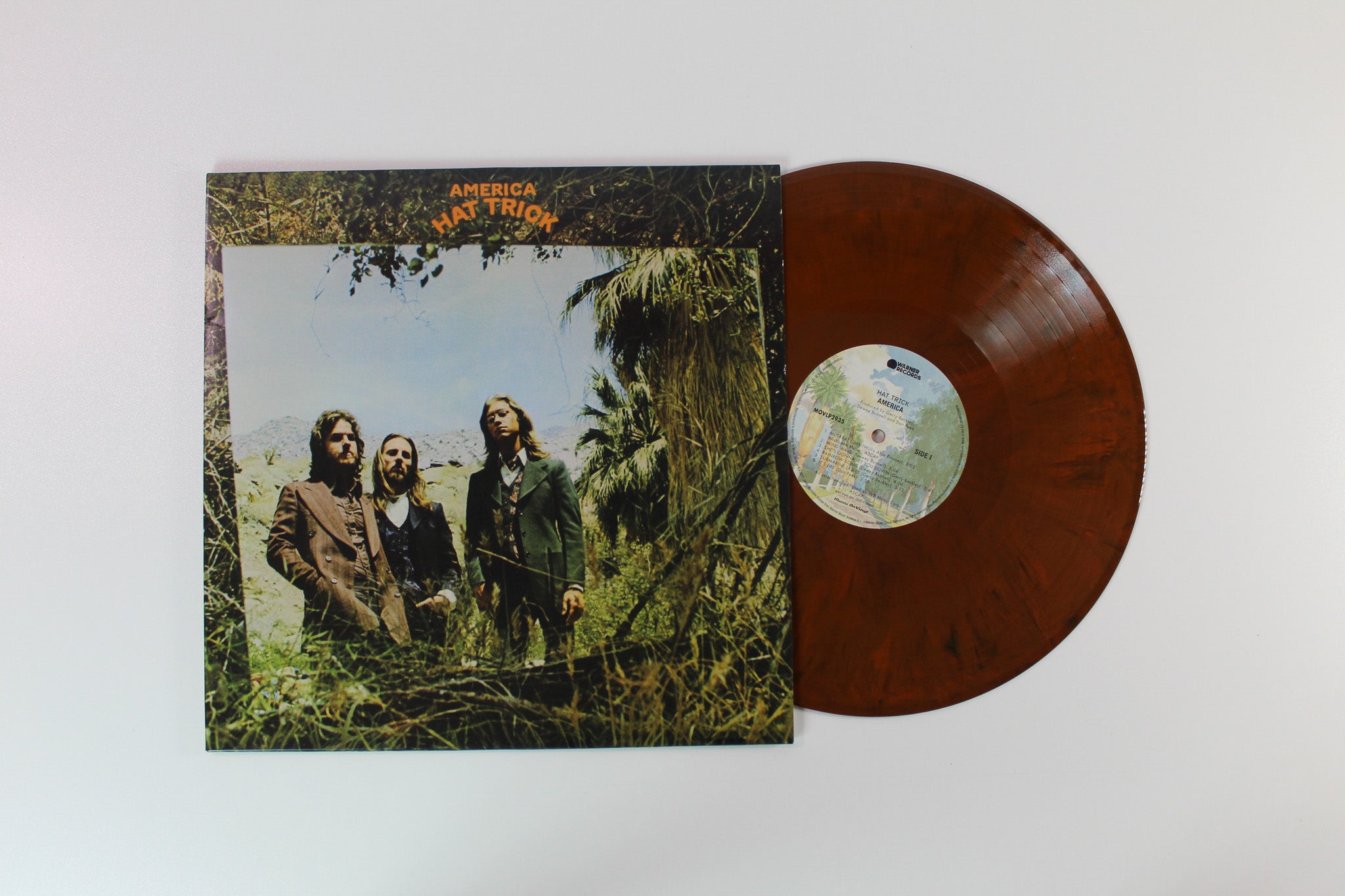 America - Hat Trick on Music On Vinyl - Safari Colored Vinyl
