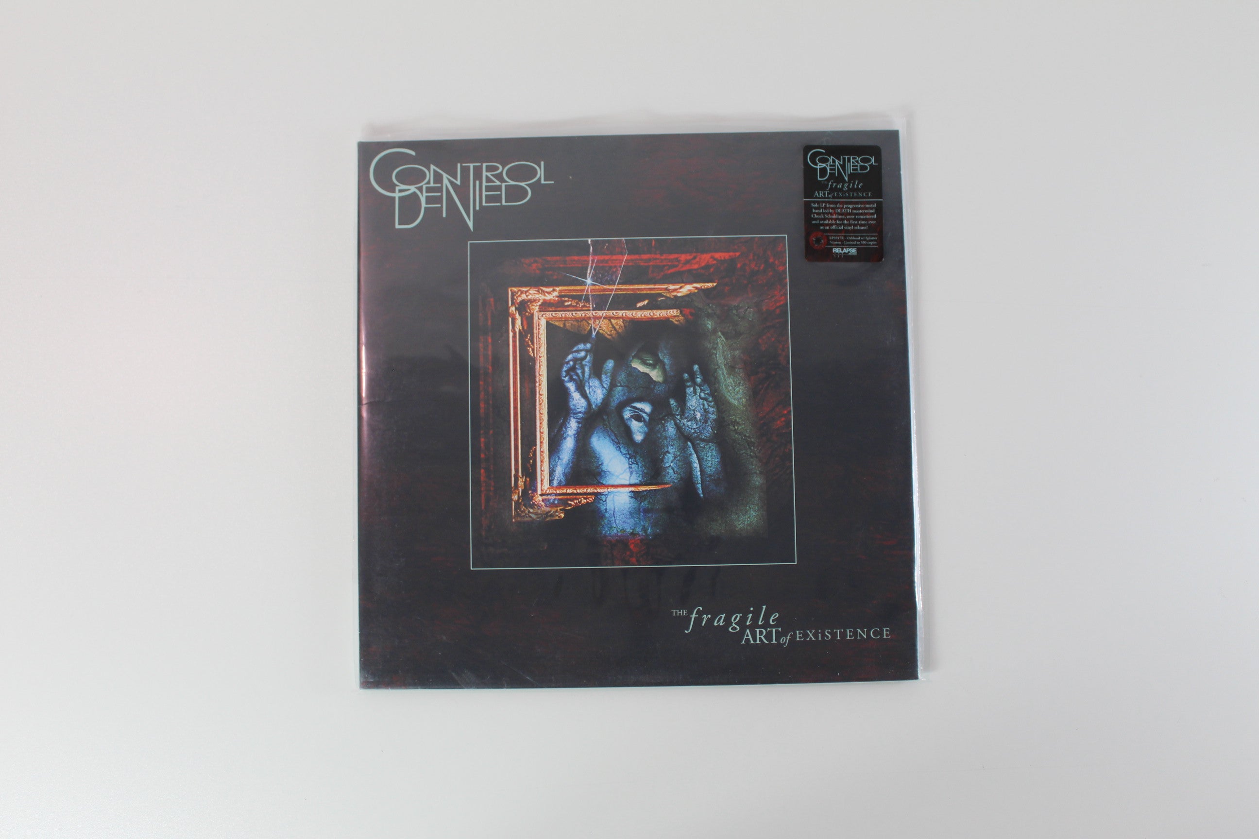 Control Denied - The Fragile Art Of Existence on Relapse Ltd Oxblood with Black and Cyan Blue Splatter Reissue