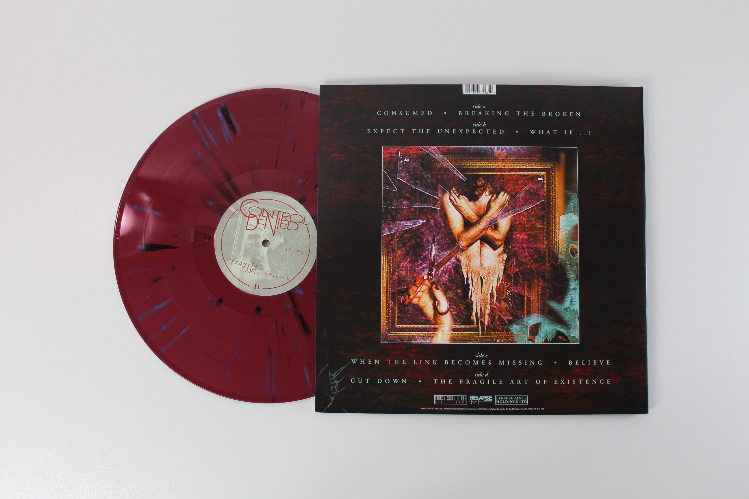 Control Denied - The Fragile Art Of Existence on Relapse Ltd Oxblood with Black and Cyan Blue Splatter Reissue