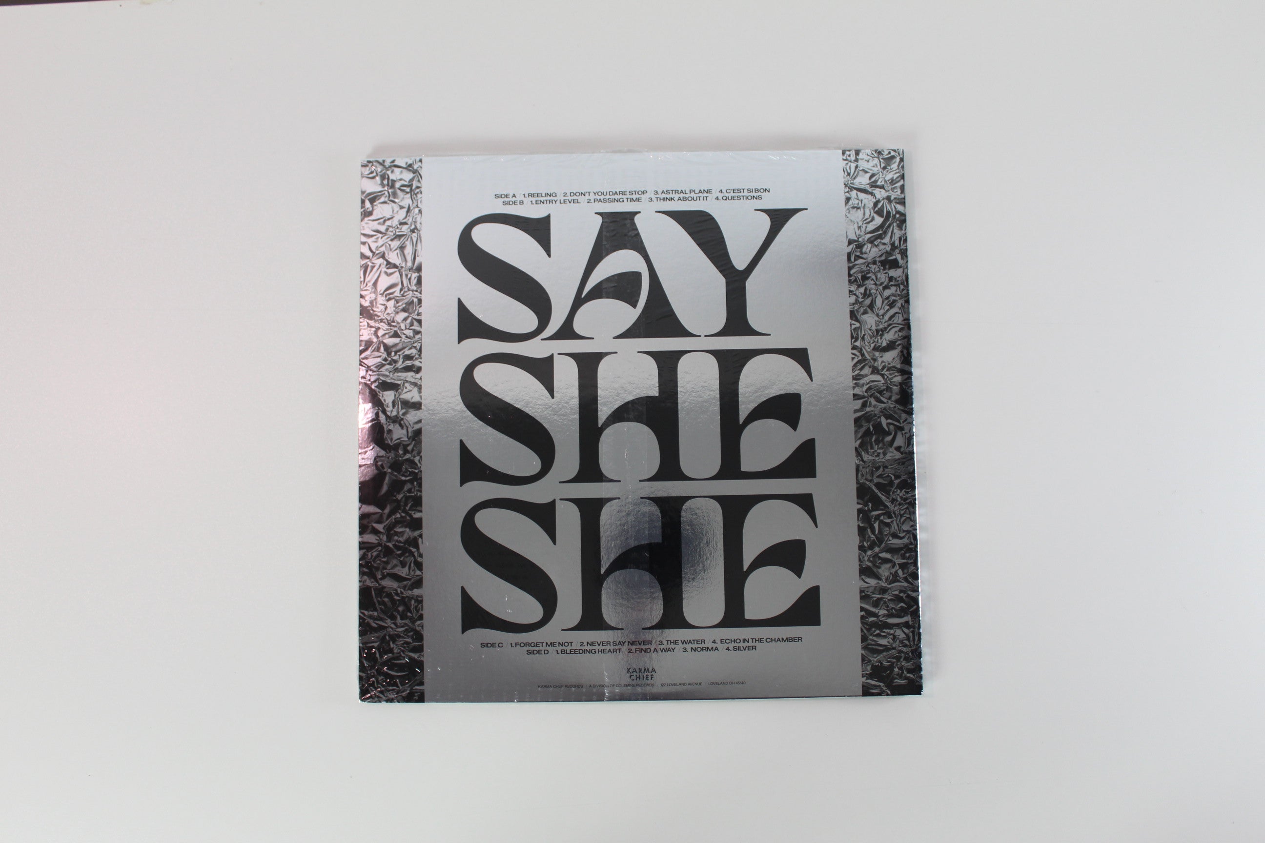 Say She She - Silver on Karma Chief Ltd Clear With Red Swirl Sealed