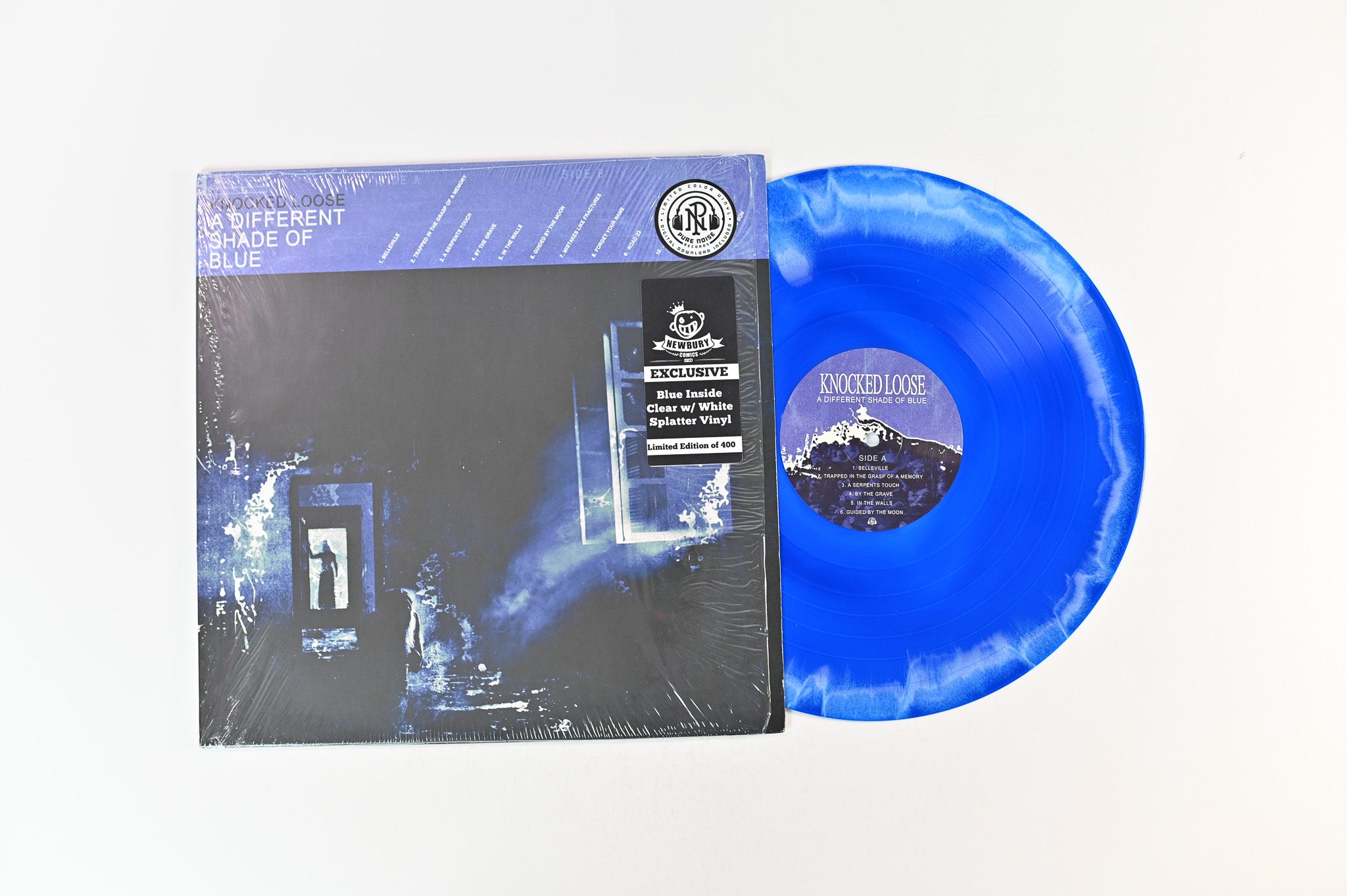 Knocked Loose - A Different Shade Of Blue on Pure Noise Ltd Blue Inside Clear w/ White Splatter Reissue