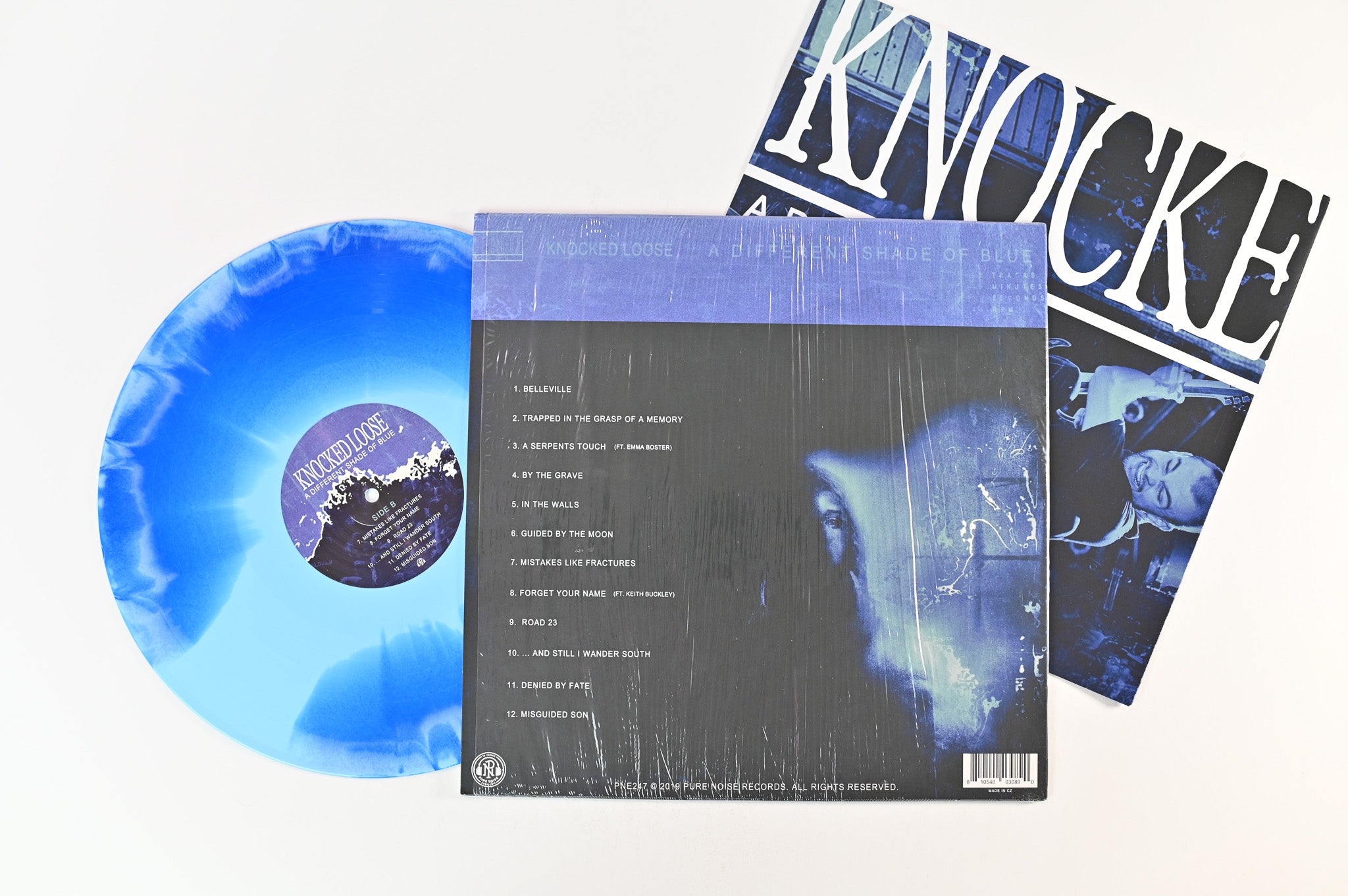 Knocked Loose - A Different Shade Of Blue on Pure Noise Ltd Blue Inside Clear w/ White Splatter Reissue