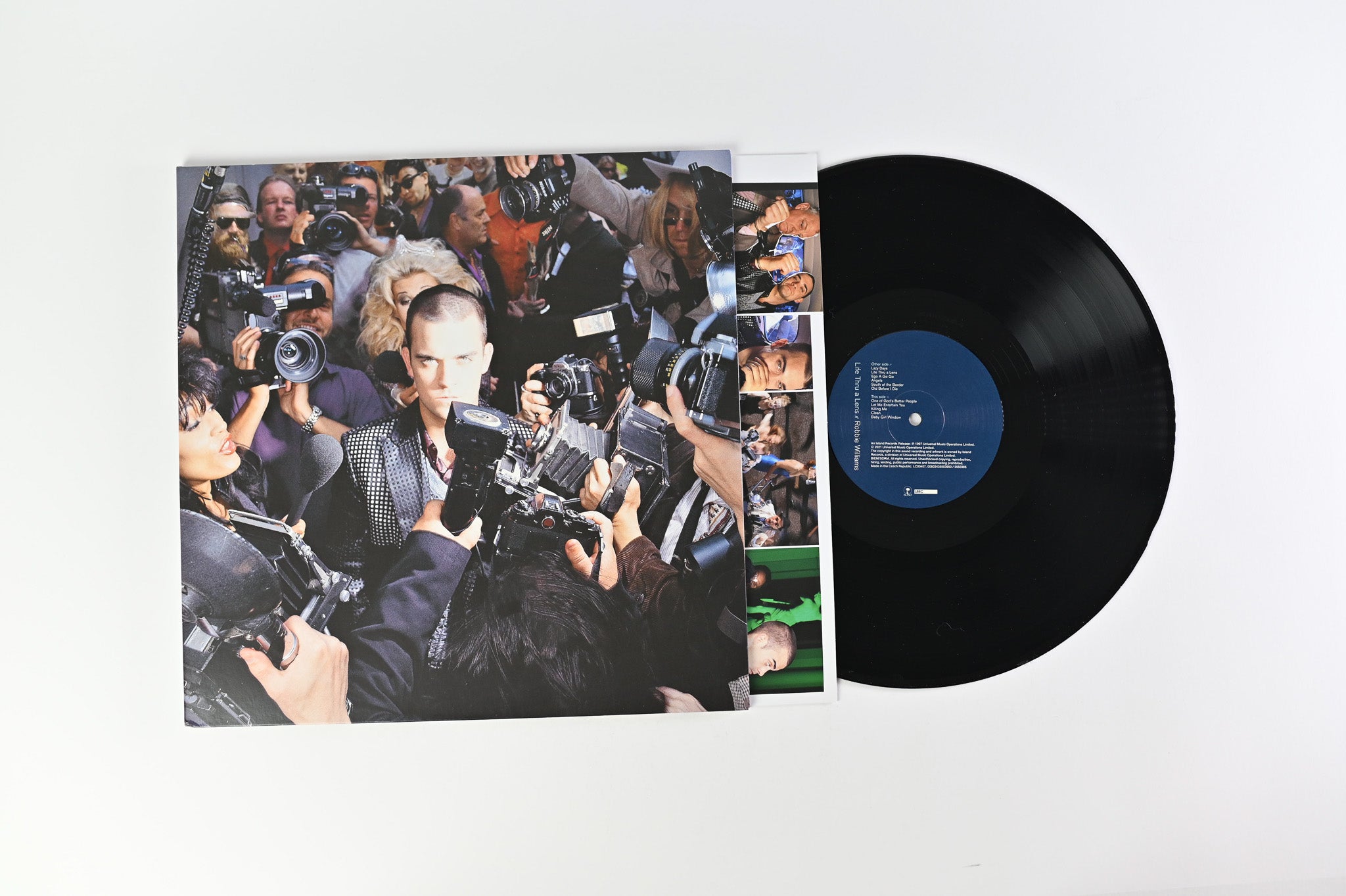 Robbie Williams - Life Thru A Lens on Island Records