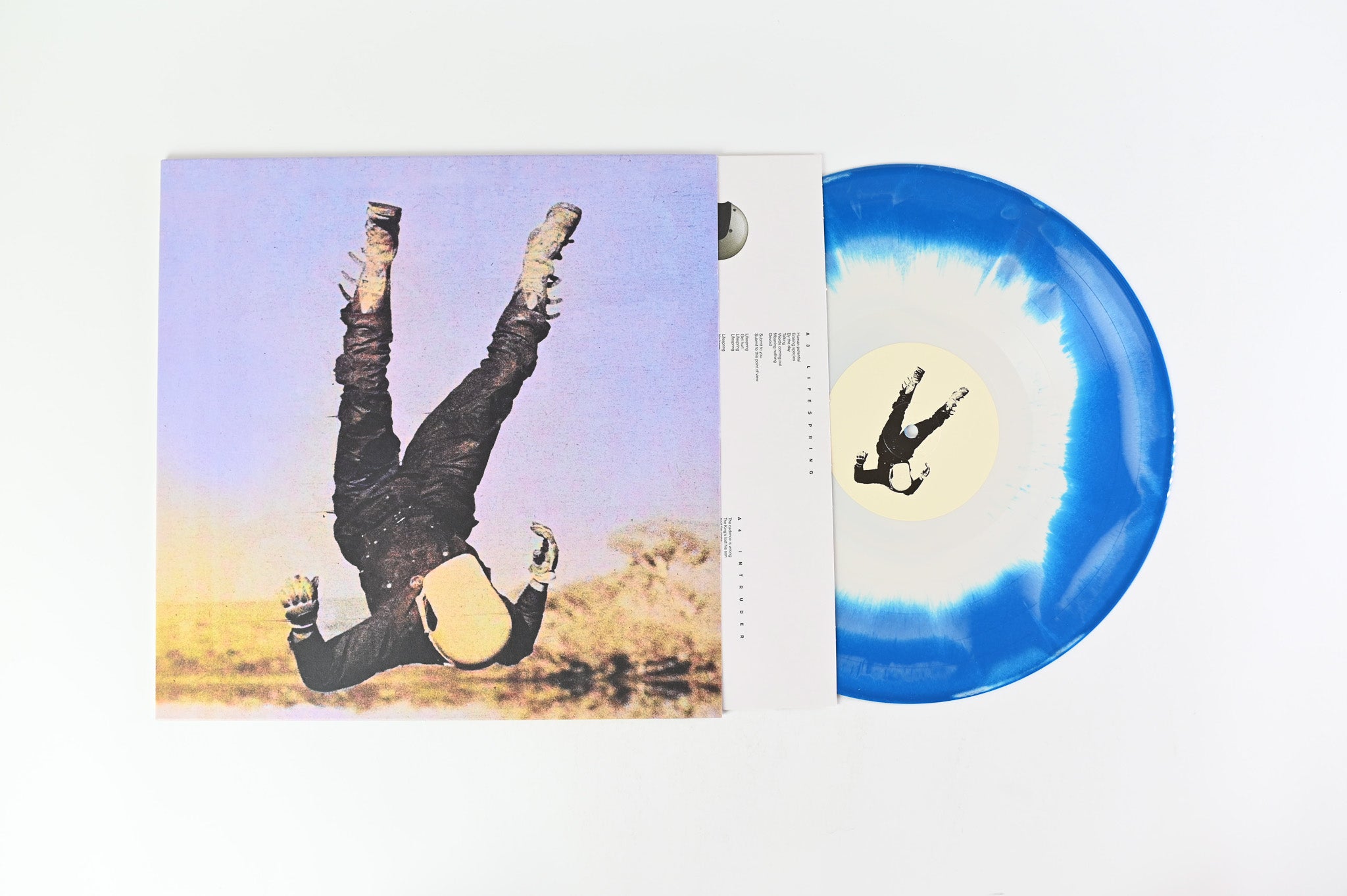 Death Bells - Between Here & Everywhere on Dais Records - Blue/Bone Smash Colored Vinyl