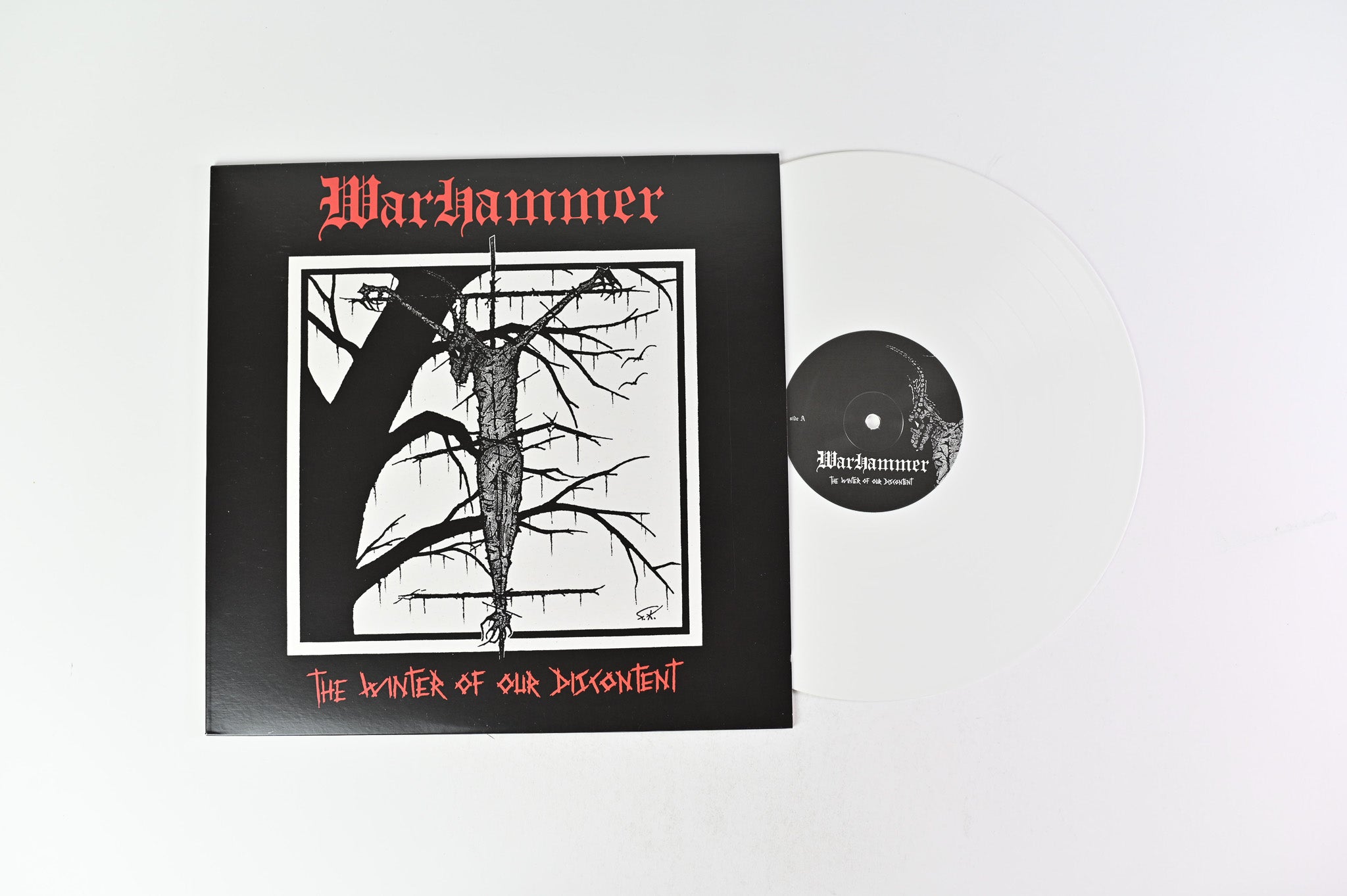 Warhammer - The Winter Of Our Discontent on The Devil's Elixir's Ltd White Vinyl Reissue