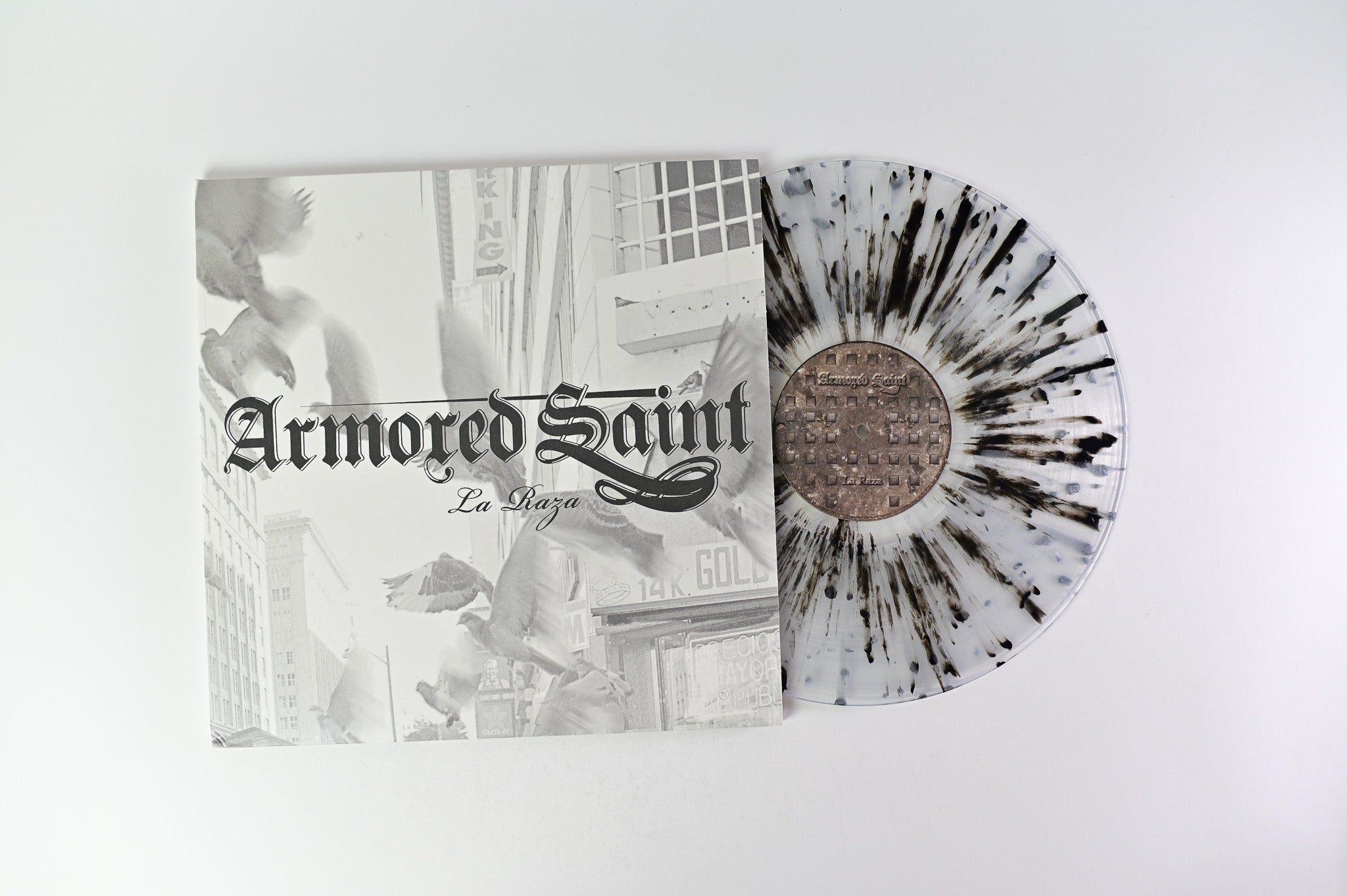 Armored Saint - La Raza on Metal Blade Ltd Clear with Black & Grey Splatter