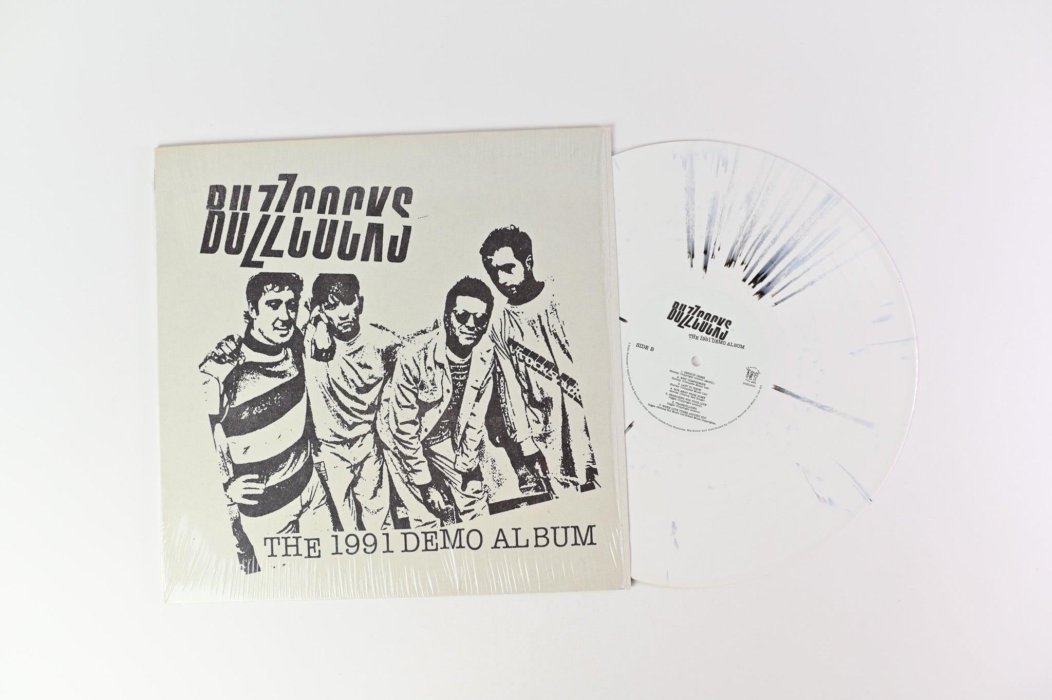Buzzcocks - The 1991 Demo Album on Cherry Red White with Black Splatter Reissue