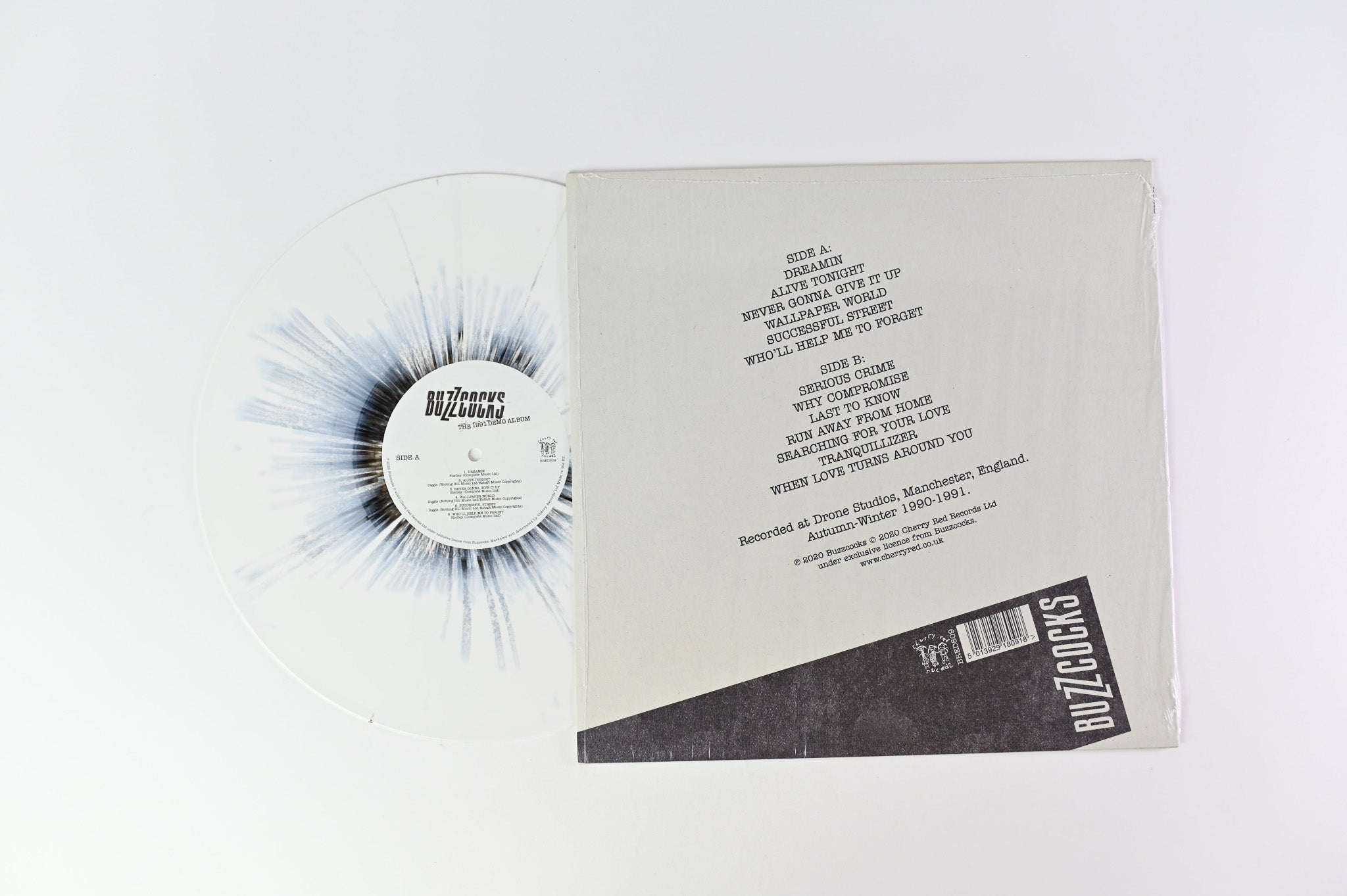 Buzzcocks - The 1991 Demo Album on Cherry Red White with Black Splatter Reissue