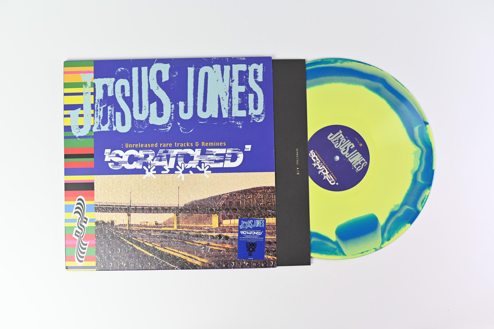 Jesus Jones - Scratched (Unreleased Rare Tracks & Remixes) on Demon Records Blue & Yellow Marbled Vinyl