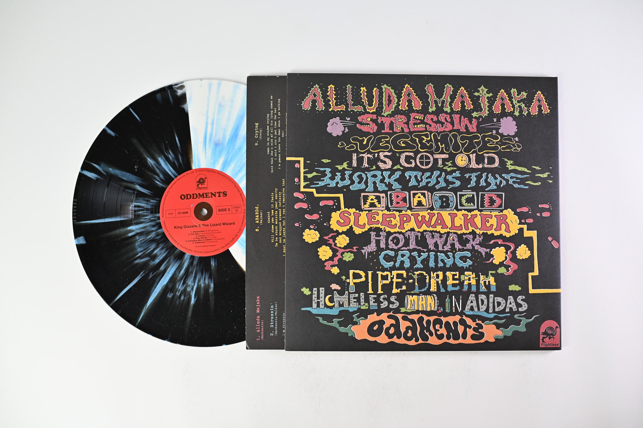 King Gizzard And The Lizard Wizard - Oddments on Flightless - Black & White Split With Cyan Blue Splatter